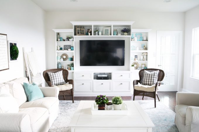 living room with furniture and the custom entertainment system finished