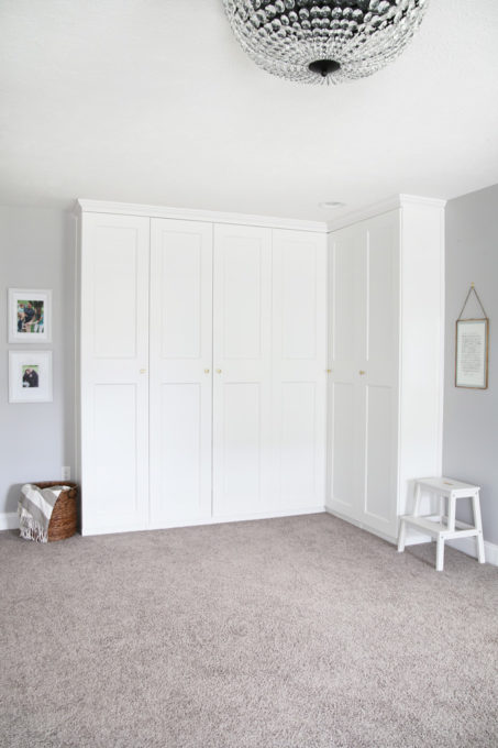 This super helpful post talks about IKEA's 3 best storage systems-- ALGOT, BESTA, and PAX-- and gives great ideas for using them in your home! | IKEA BESTA storage system, modular storage system, IKEA ALGOT closet system, custom closet system, IKEA PAX wardrobe system, DIY wardrobe, IKEA hack, how to plan for and install IKEA storage systems, built in storage unit for home office made with IKEA PAX wardrobe system and custom trim work, GRIMO doors