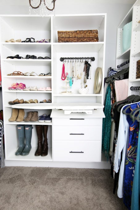 Folding ironing board in an organized closet, closet ideas