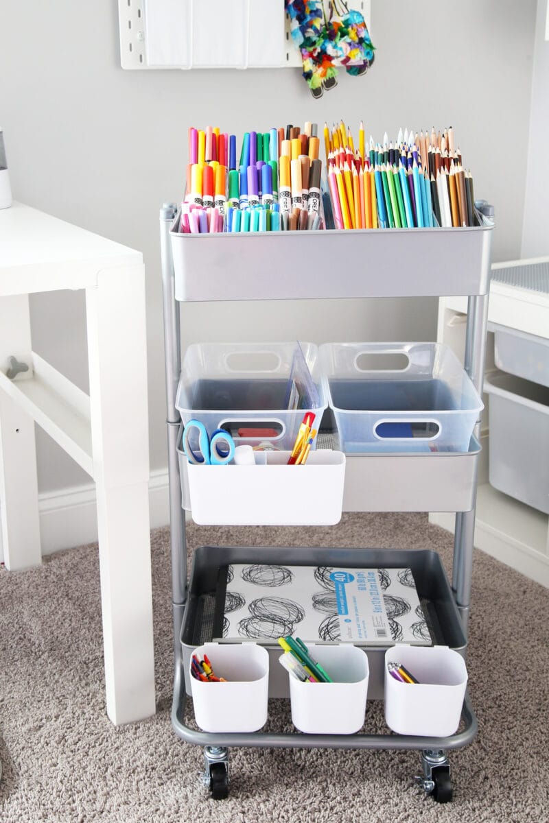 Rolling cart holding organized art and craft supplies