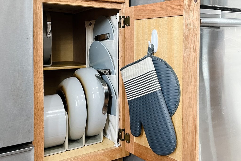 Use Command Strips to organize your kitchen utensils and storage space