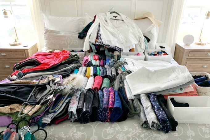 Decluttering clothes on a bed