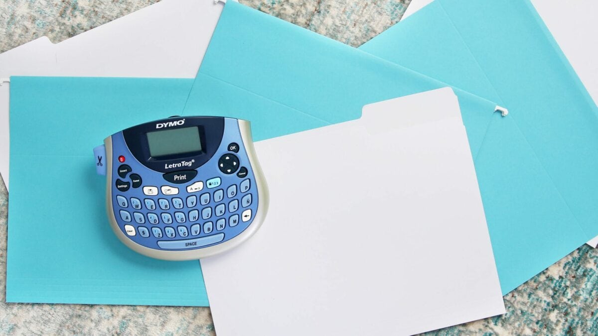 Label maker on top of blue file folders