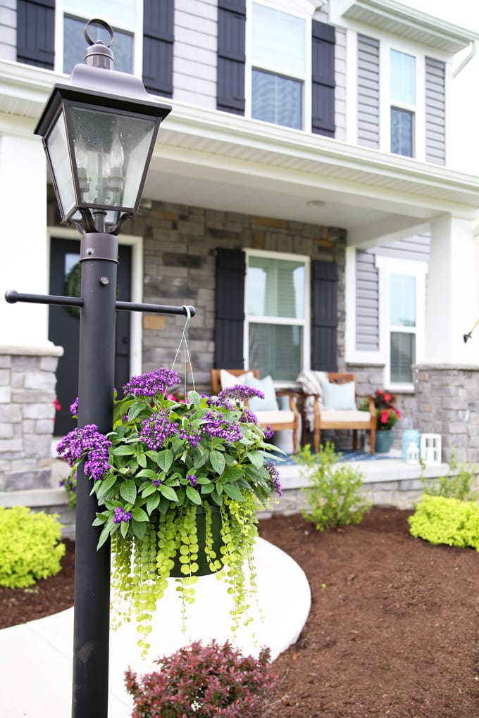 Hanging Basket of Flowers on a Lamp Post in Front of a Craftsman Style Home, Ryan Homes Palermo Elevation L