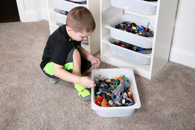 little boy playing with LEGOs