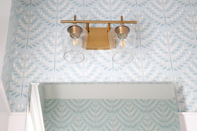 Brass Light Fixture Detail in a Pretty Powder Room