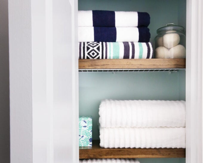 Organized Linen Closet with Neatly Folded Towels