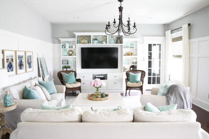 Neutral Living Room with Aqua Accents and High Board and Batten in a Ryan Homes Palermo