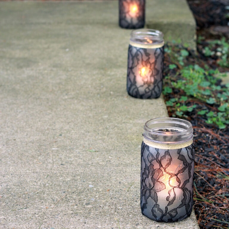 Black Lace Mason Jar Luminaries on a Sidewalk