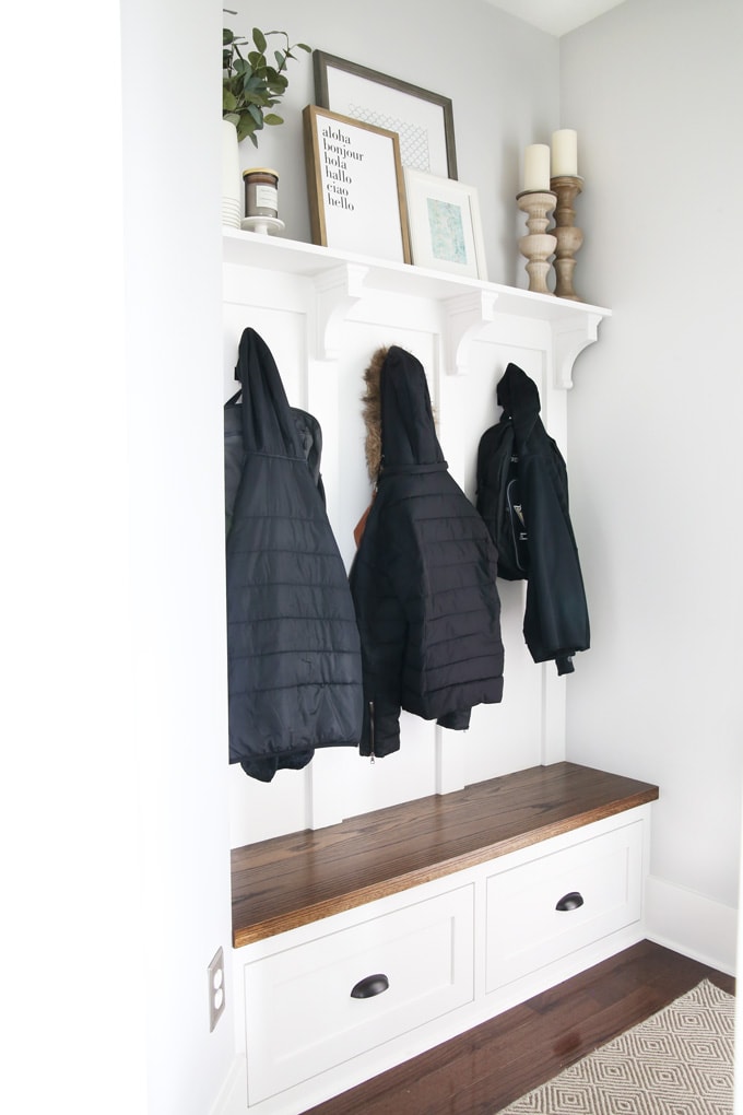 Mudroom with coats and backpacks hanging up