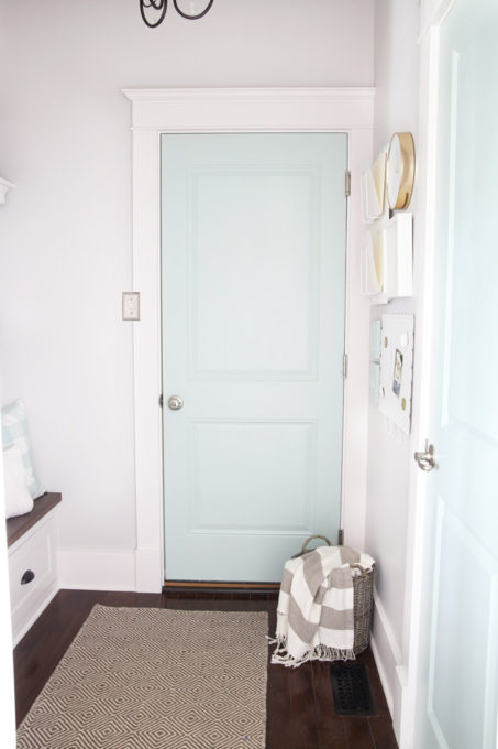 Aqua Painted Door in Organized Mudroom