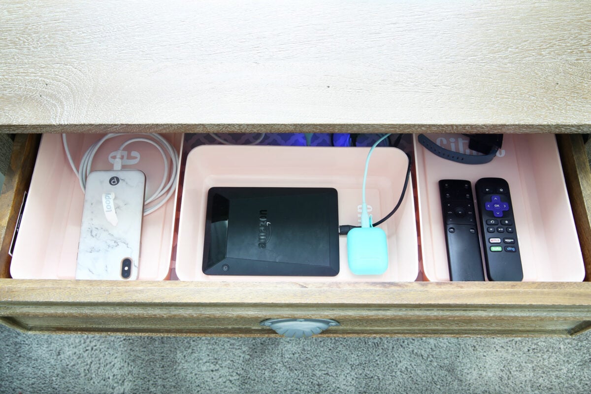 Nightstand Drawer with Devices Charging in a Charging Station