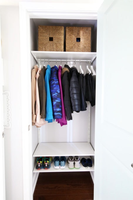 Organized Coat Closet with Shoes Lined Up on a Low Shelf