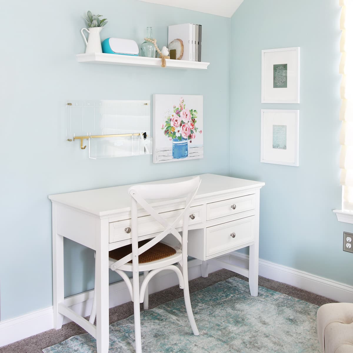 white desk with a white chair in an organized home office