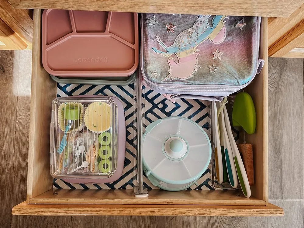 Inside of a drawer with lunch supplies