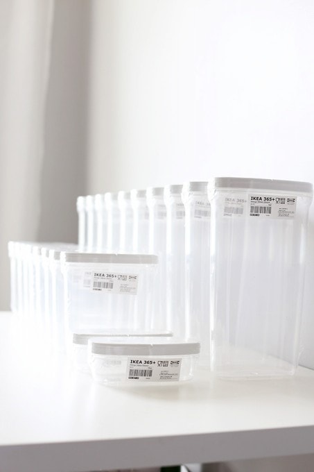 all of our empty pantry containers lined up on the counter. 