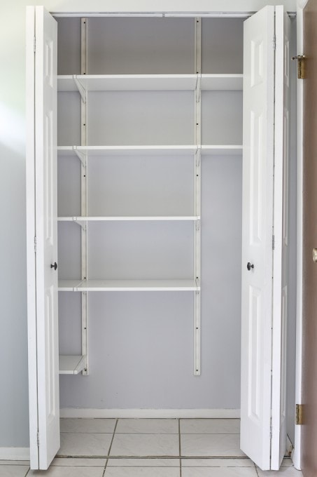 An empty pantry with just the shelving system installed