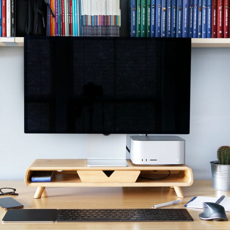 Laptop Computer, Paper Planner, and Cell Phone on a Desk