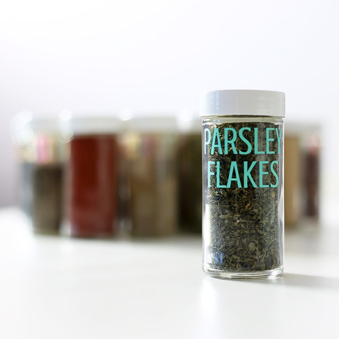 close up of parsley flakes in a spice container with a DIY vinyl label