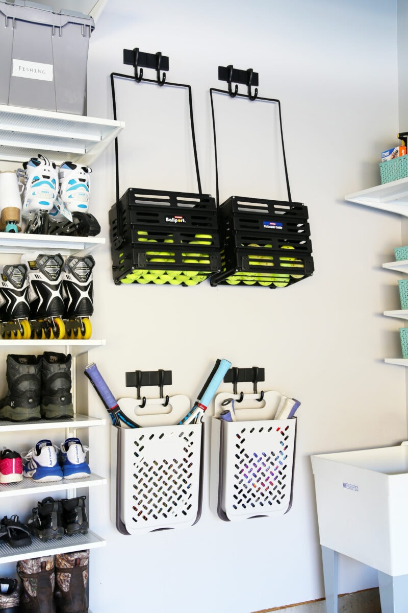 pickleball and tennis storage on a garage wall