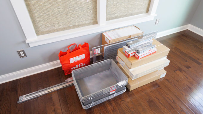 Pieces and supplies for building an Elfa shelving unit from The Container Store 