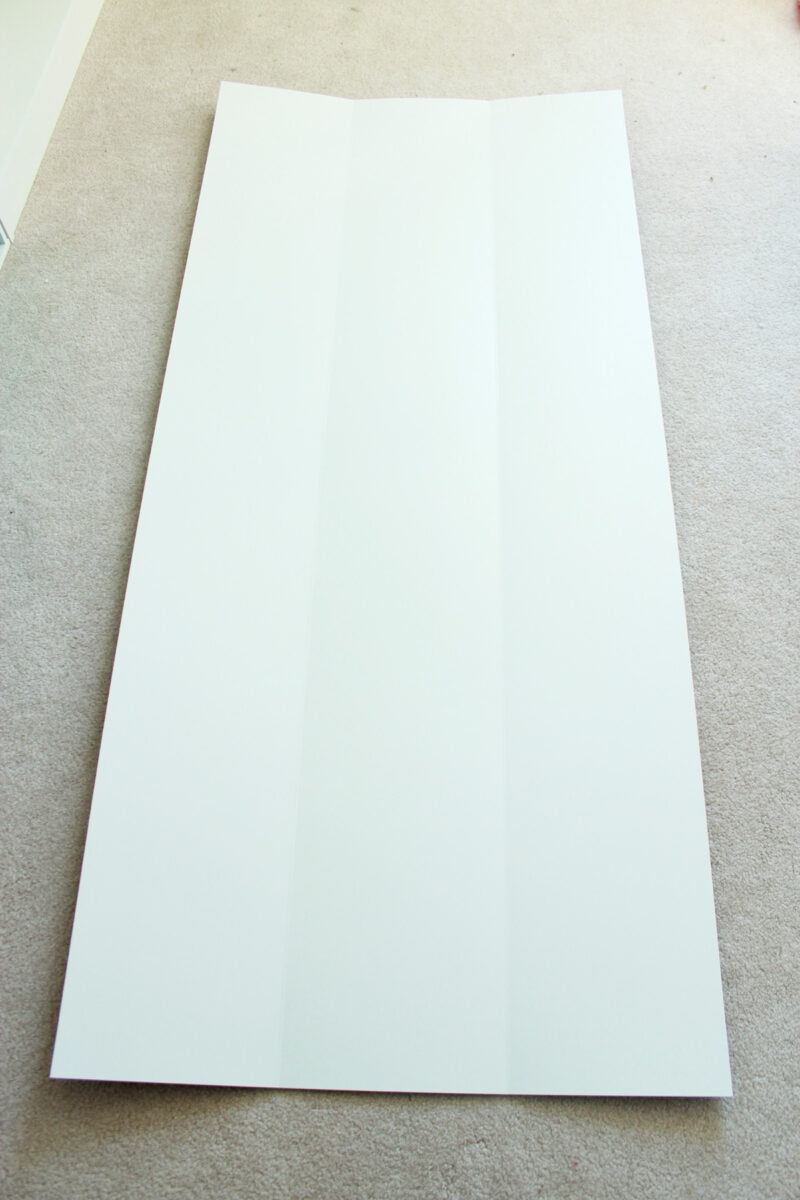 Plain white bookshelf backing