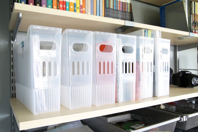 close up of plastic magazine bins on the shelf