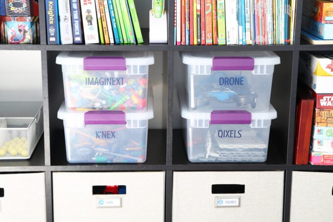 Plastic lidded bins used to organize toys