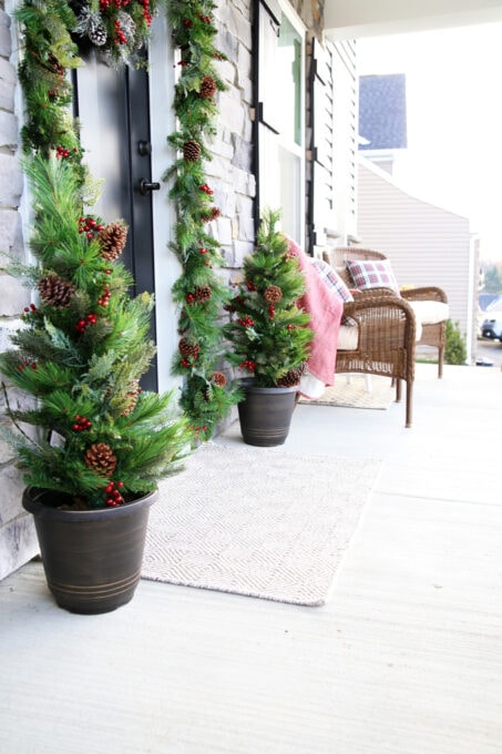 Front Porch Decorated for Christmas with Garland Around the Front Door