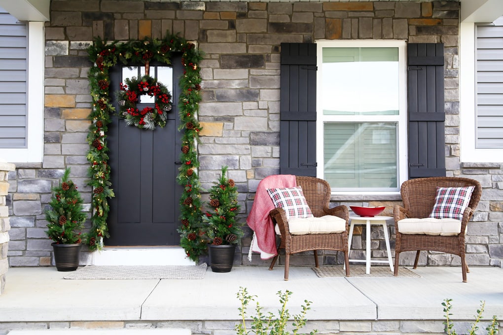 wood shutters on the outside of the house during Christmas time