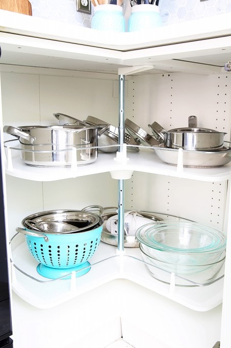 Awesome tips and tricks for organizing a small kitchen-- and proof that small kitchens can be beautiful too! Click through to the post for her amazing organization tips!