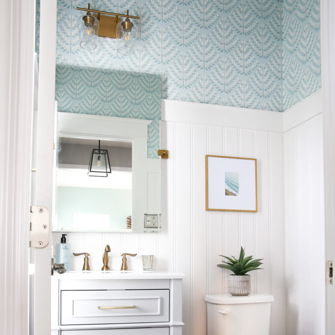 Powder Room with Beadboard and Aqua Wallpaper