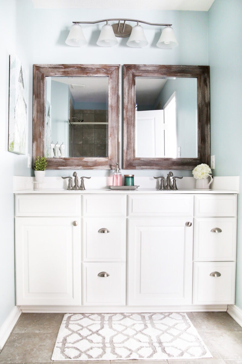 Primary Bathroom Vanity with Updated Mirrors and Aqua Painted Walls