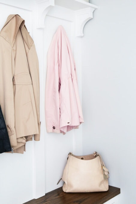 Organized purse on a mudroom bench