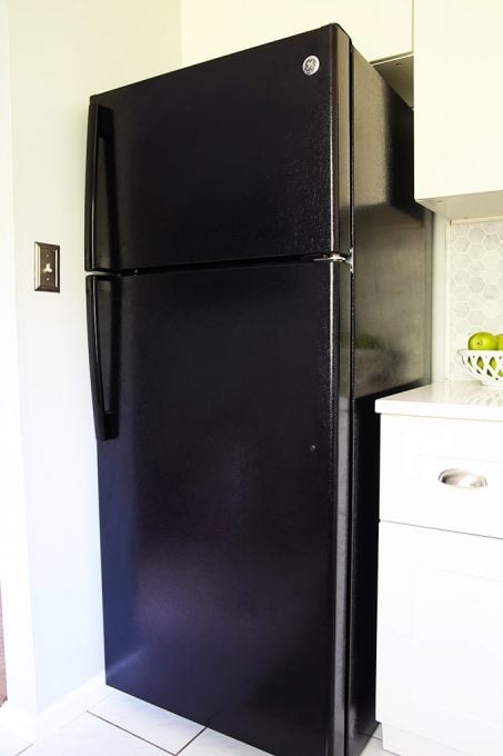 the small black fridge that replaced the larger one