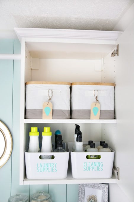 Organized Laundry Room Cabinet with Laundry Supplies, Cleaning Supplies, and Light Bulbs