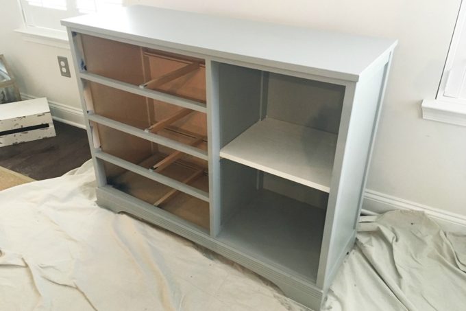 the dresser without the drawer and cabinet faces on painted in a light gray