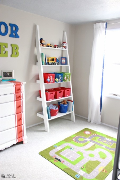 Ladder shelf holding toys in an organized kids' bedroom