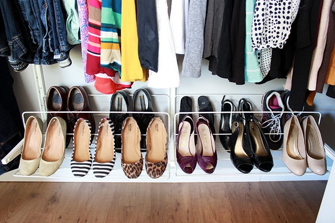 shoes on a shoe rack in the closet