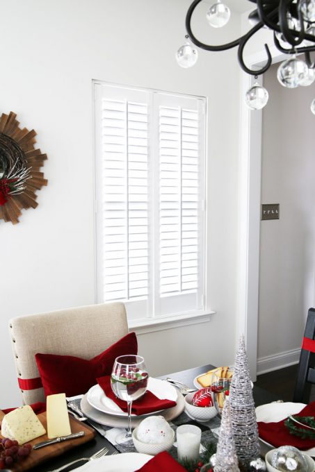 dining room window with newly installed wooden shutters