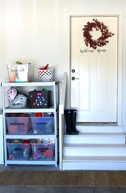 Garage door with a DIY storage rack storing outdoor toys