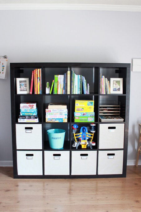 toys organized in IKEA KALLAX cube unit