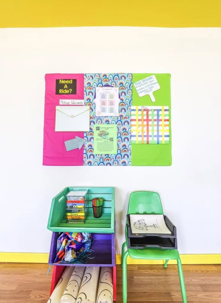 Colorful bulletin board with stackable shelves underneath