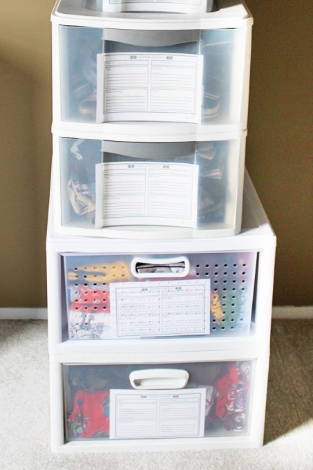 Hand me down clothes in stacked white storage drawers