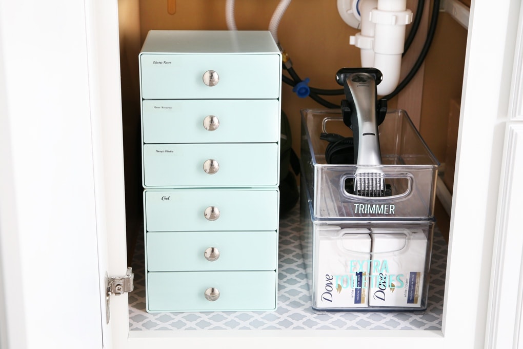 Light blue drawers under the bathroom sink, bathroom organization storage solutions