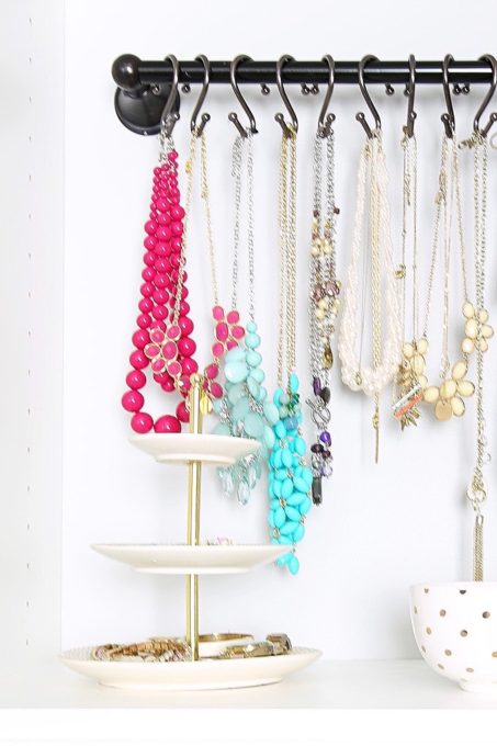 Tiered tray for organizing small jewelry in an organized closet