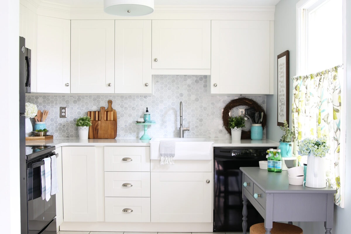 Small white kitchen in a townhouse, IKEA SEKTION cabinets with brilliant storage ideas