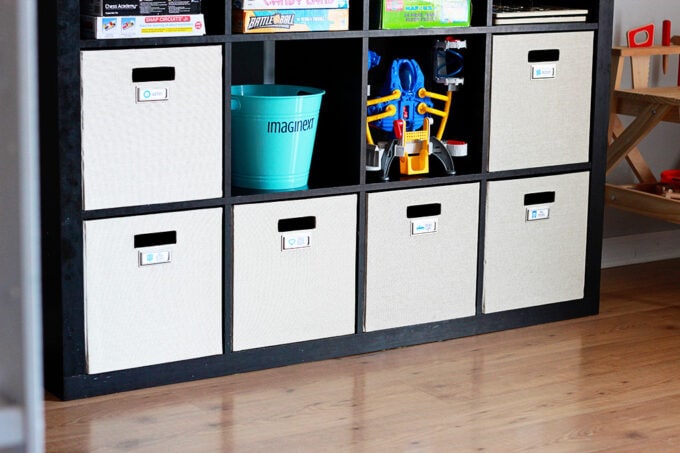 Kids' toys organized in fabric cubes