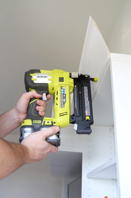 attaching the moulding with a brad nailer