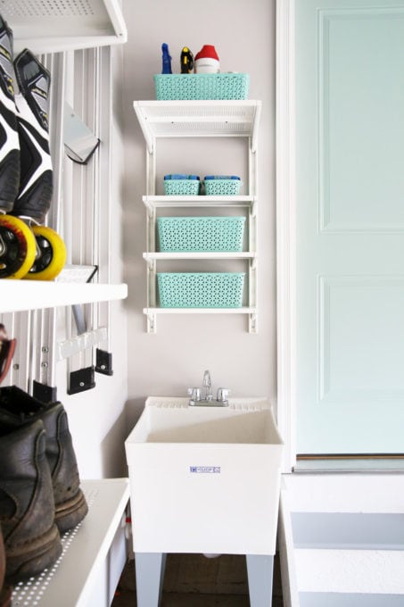 Utility Tub with IKEA ALGOT Shelves and Organized Cleaning Supplies in the Garage